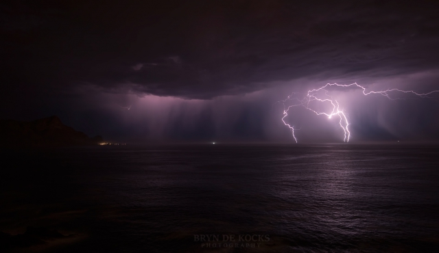 lightening strikes over the ocean