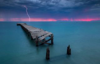 strand lightning sunset